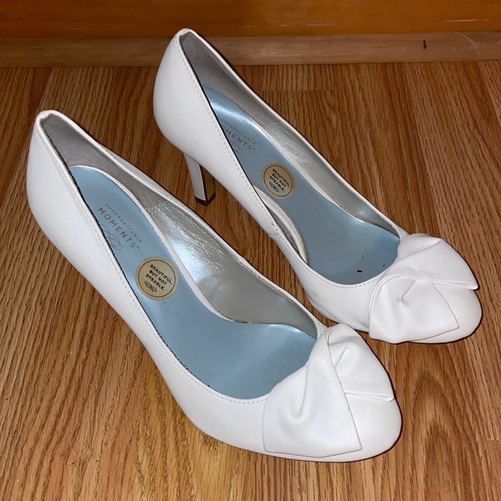 white high heels with bow detail
